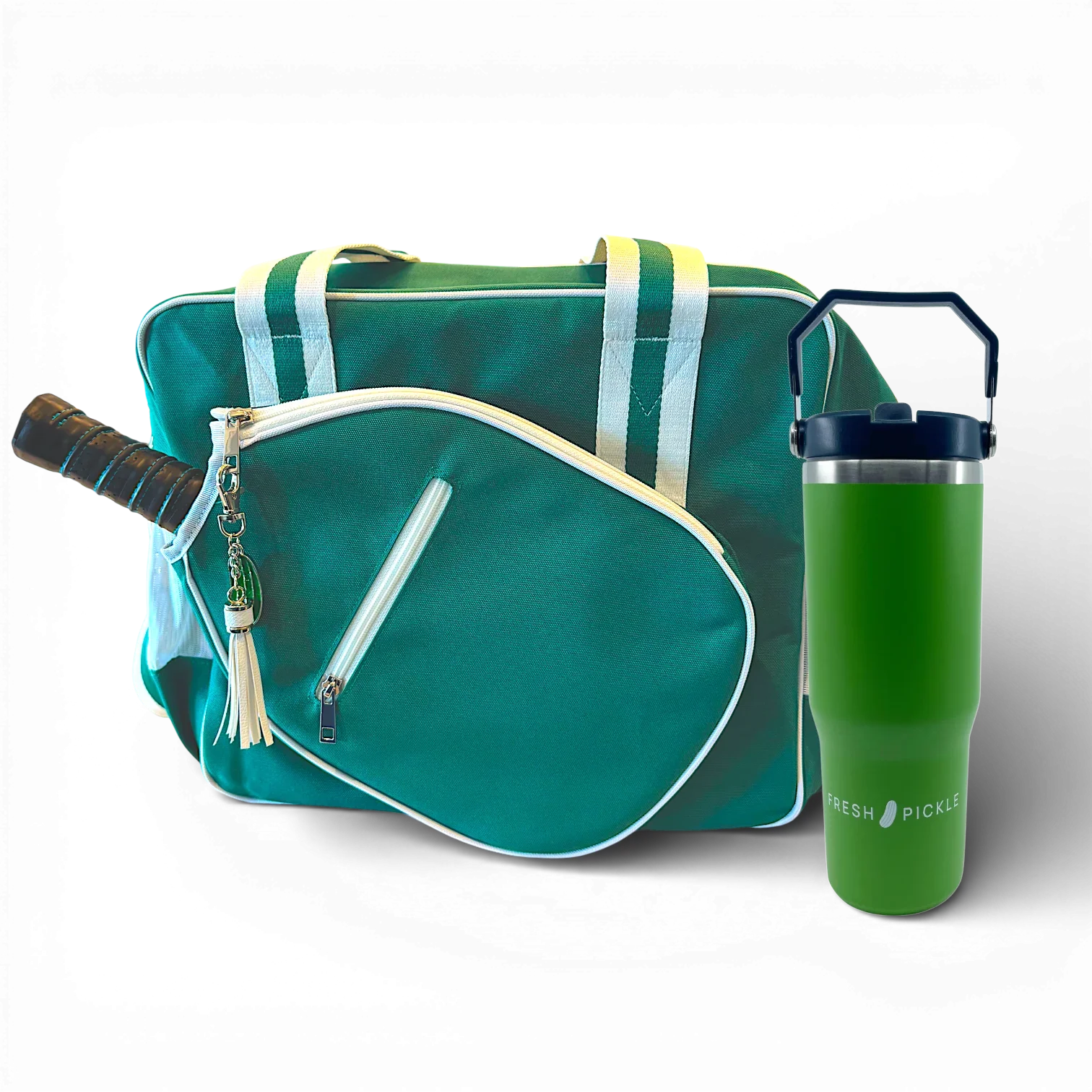 Green and white pickleball bag with paddle, tassel keychain, and green tumbler