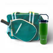 Green and white pickleball bag with paddle, tassel keychain, and green tumbler